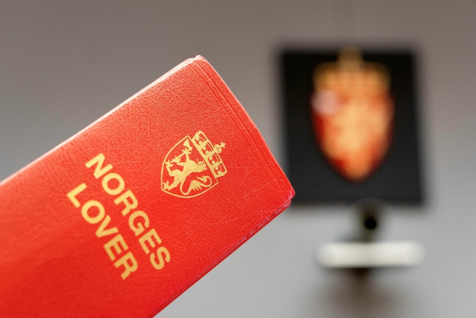 Illustrasjonsfoto. Bildet viser en bok med Norges lover. Foto: Gorm Kallestad / NTB