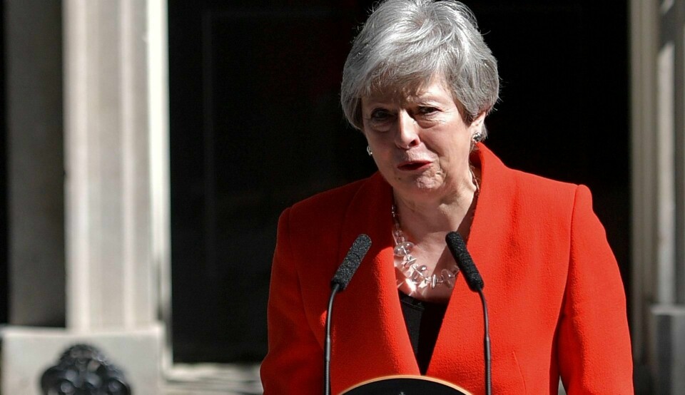 GÅR AV: Theresa May går av som partileder 7. juni og vil sitte som statsminister til inntil 20. juli. FOTO: DANIEL LEAL-OLIVAS/NTB SCANPIX
