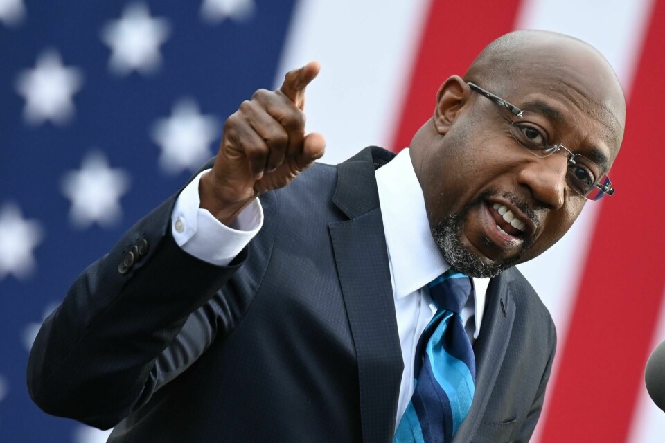 (FILES) In this file photo taken on December 15, 2020 Democratic Senate candidate Reverend Raphael Warnock speaks during a campaign rally in Atlanta, Georgia. - Democrat Raphael Warnock ousted an incumbent Republican onJanuary 6, 2021 in the first of two critical runoff elections in Georgia that will decide control of the US Senate at the outset of Joe Biden's presidency, networks projected. (Photo by JIM WATSON / AFP) (FILES) In this file photo taken on December 15, 2020 Democratic Senate candidate Reverend Raphael Warnock speaks during a campaign rally in Atlanta, Georgia. - Democrat Raphael Warnock ousted an incumbent Republican onJanuary 6, 2021 in the first of two critical runoff elections in Georgia that will decide control of the US Senate at the outset of Joe Biden's presidency, networks projected. (Photo by JIM WATSON / AFP)