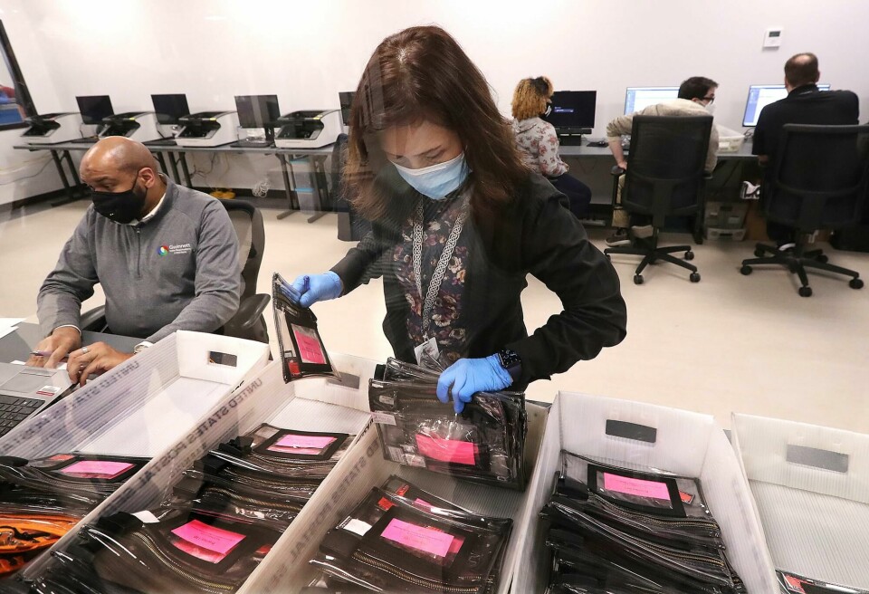 Election workers tabulate ballots at the Beauty P. Baldwin Voter Registrations and Elections Building, Tuesday, Jan. 5, 2021, in Lawrenceville, Ga. (Curtis Compton/Atlanta Journal-Constitution via AP) Election workers tabulate ballots at the Beauty P. Baldwin Voter Registrations and Elections Building, Tuesday, Jan. 5, 2021, in Lawrenceville, Ga. (Curtis Compton/Atlanta Journal-Constitution via AP)