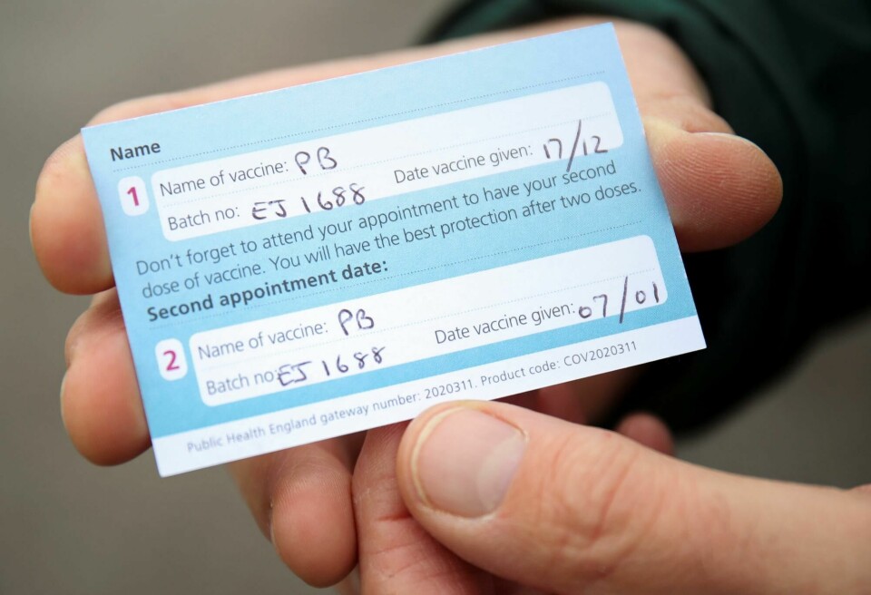 A COVID-19 vaccination record card is seen at a drive through vaccination centre, amid the outbreak of the coronavirus disease (COVID-19), in Hyde, Britain January 7, 2021. REUTERS/Molly Darlington A COVID-19 vaccination record card is seen at a drive through vaccination centre, amid the outbreak of the coronavirus disease (COVID-19), in Hyde, Britain January 7, 2021. REUTERS/Molly Darlington