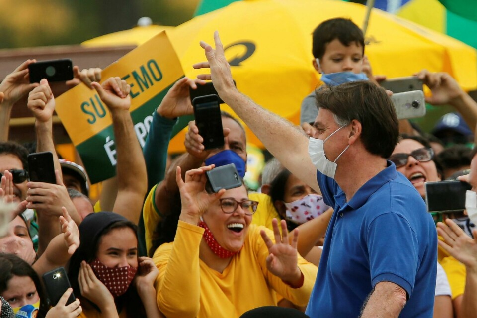 Brazil's President Jair Bolsonaro greets supporters during a protest against the President of the Chamber of Deputies Rodrigo Maia, Brazilian Supreme Court, quarantine and social distancing measures, amid the coronavirus disease (COVID-19) outbreak, in Brasilia, Brazil May 17, 2020. REUTERS/Adriano Machado Brazil's President Jair Bolsonaro greets supporters during a protest against the President of the Chamber of Deputies Rodrigo Maia, Brazilian Supreme Court, quarantine and social distancing measures, amid the coronavirus disease (COVID-19) outbreak, in Brasilia, Brazil May 17, 2020. REUTERS/Adriano Machado