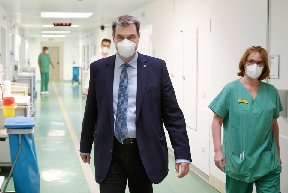 Delstatsleder Markus Söder i Bayern har blitt populær på harde lokale tiltak mot koronaviruset. Han var blant annet rask med å innføre bruk av munnbind på offentlige plasser i delstaten. Foto: Tobias Hase / NTB scanpix