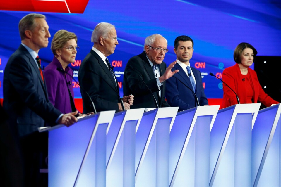 Democratic presidential candidate Sen. Bernie Sanders, I-Vt.,, center, speaks as fellow candidates businessman Tom Steyer, from left, Sen. Elizabeth Warren, D-Mass., former Vice President Joe Biden, former South Bend Mayor Pete Buttigieg and Sen. Amy Klobuchar, D-Minn. listen, Tuesday, Jan. 14, 2020, during a Democratic presidential primary debate hosted by CNN and the Des Moines Register in Des Moines, Iowa. (AP Photo/Patrick Semansky)