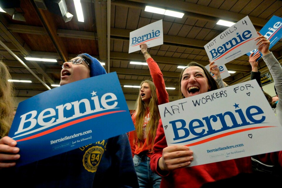 Supporters of US Presidential Candidate Senator Bernie Sanders cheer and wave campaign signs as they await his arrival at a rally at Keene State College in Keene, New Hampshire on February 9, 2020. (Photo by Joseph Prezioso / AFP) Supporters of US Presidential Candidate Senator Bernie Sanders cheer and wave campaign signs as they await his arrival at a rally at Keene State College in Keene, New Hampshire on February 9, 2020. (Photo by Joseph Prezioso / AFP)