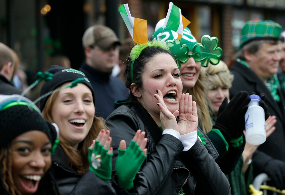 Spectators cheer during the St. Patrick's Day parade, Sunday, March 15, 2015, in Boston's South Boston neighborhood. Sunday's parade through the traditionally Irish-American enclave was shorter than years past: So much snow remains piled on sidewalks after the brutal winter that the city has had to cut the route in half. (AP Photo/Steven Senne) Spectators cheer during the St. Patrick's Day parade, Sunday, March 15, 2015, in Boston's South Boston neighborhood. Sunday's parade through the traditionally Irish-American enclave was shorter than years past: So much snow remains piled on sidewalks after the brutal winter that the city has had to cut the route in half. (AP Photo/Steven Senne)