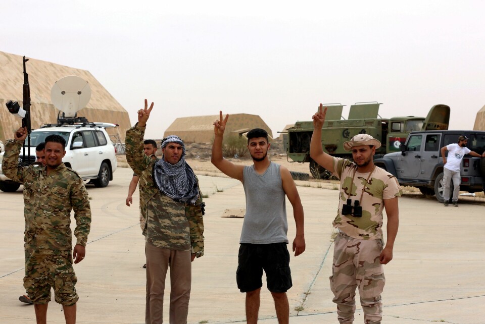 FILE PHOTO: Members of Libya's internationally recognised government flash victory signs after taking control of Watiya airbase, southwest of Tripoli, Libya May 18, 2020. REUTERS/Hazem Ahmed/File Photo FILE PHOTO: Members of Libya's internationally recognised government flash victory signs after taking control of Watiya airbase, southwest of Tripoli, Libya May 18, 2020. REUTERS/Hazem Ahmed/File Photo