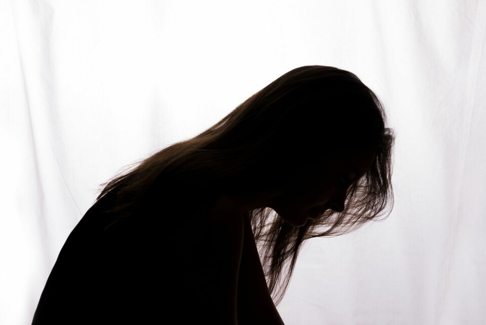 Silhouette of a young woman with problems - horizontal Silhouette of a young woman with problems - horizontal