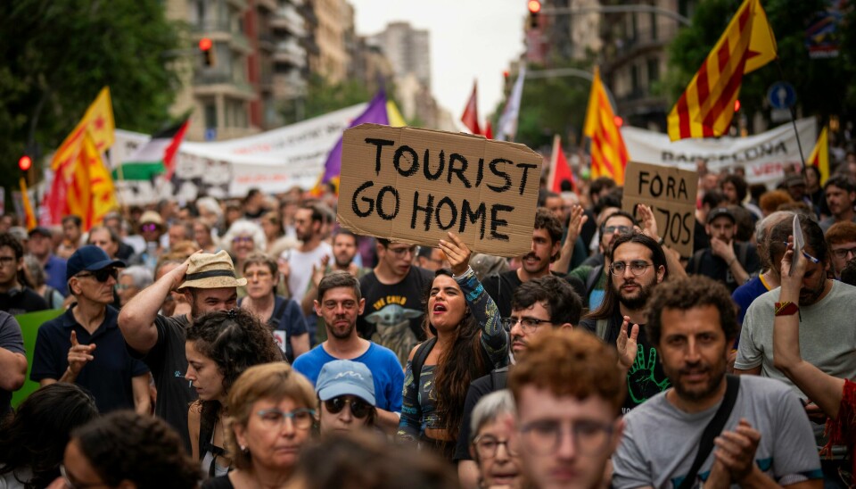 Innbyggere i Barcelona og flere andre spanske byer har de siste ukene protestert mot masseturismen og de problemene dette har ført til på boligmarkedet. Innbyggere i Barcelona og flere andre spanske byer har de siste ukene protestert mot masseturismen og de problemene dette har ført til på boligmarkedet. Foto: AP / NTB