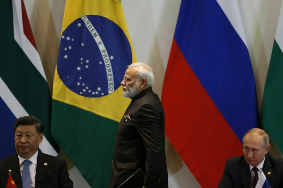 Kinas president Xi Jinping, Indias statsminister Narendra Modi og Russlands president Vladimir Putin avbildet under et BRICS-møte i 2019. Disse tre landene må komme mer på banen med klimamål, forventer COP26-vertskapet. Kinas president Xi Jinping, Indias statsminister Narendra Modi og Russlands president Vladimir Putin avbildet under et BRICS-møte i 2019. Disse tre landene må komme mer på banen med klimamål, forventer COP26-verskapet.