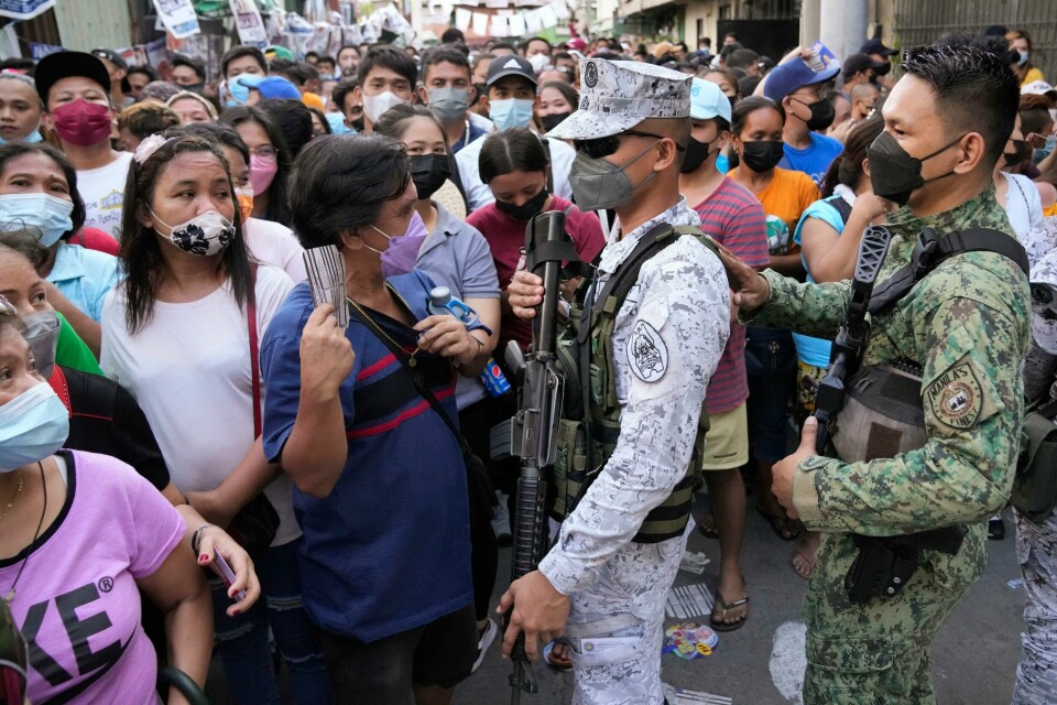 Velgere står i kø utenfor et valglokale i Manila. Foto: Aaron Favila / AP / NTB Velgere står i kø utenfor et valglokale i Manila. Foto: Aaron Favila / AP / NTB