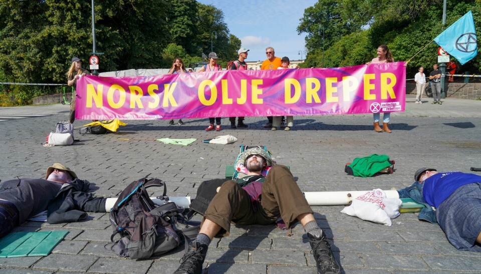 Aktivister fra Extinction Rebellion under en tidligere aksjon. Aktivister fra Extinction Rebellion aksjonerer foran Slottet i Oslo tirsdag 24. august. Foto: Ole Berg-Rusten / NTB