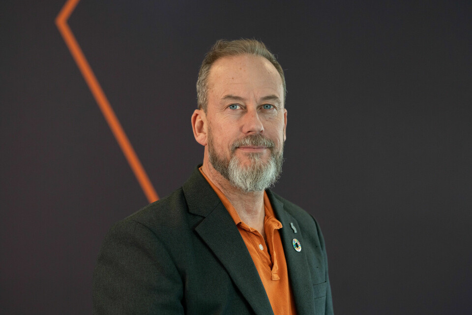 Rune Kvarme, Samfunnsbedriftene Hvit mann med skjegg. Svart blazerjakke over en oransje skjorte.