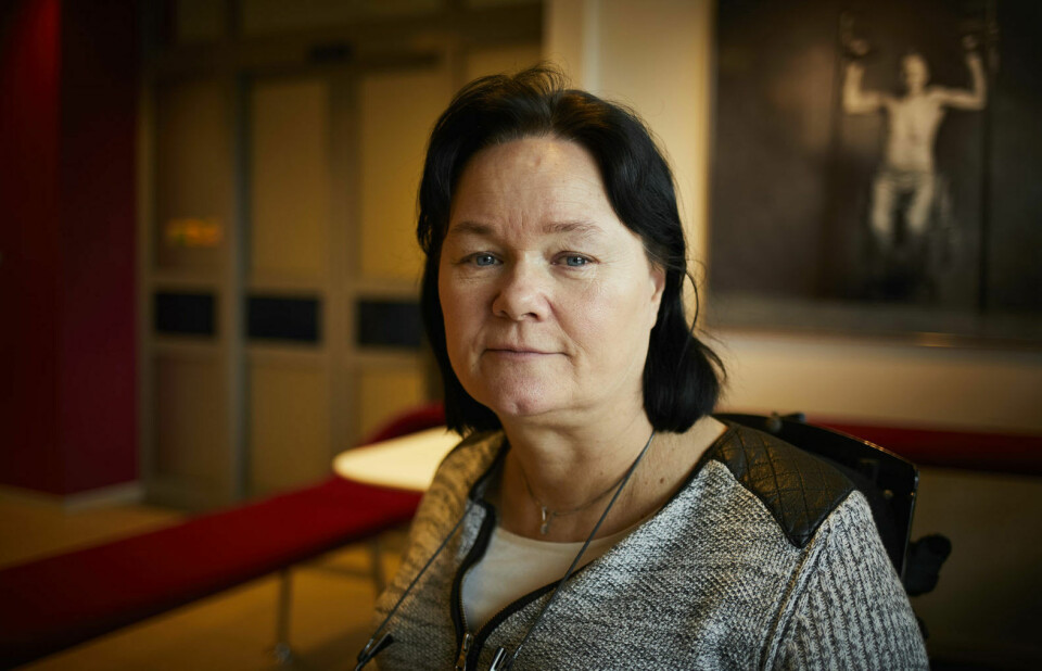 Vibeke Marøy Melstrøm Hvit kvinne med svart hår og grå genser. Smiler svakt.