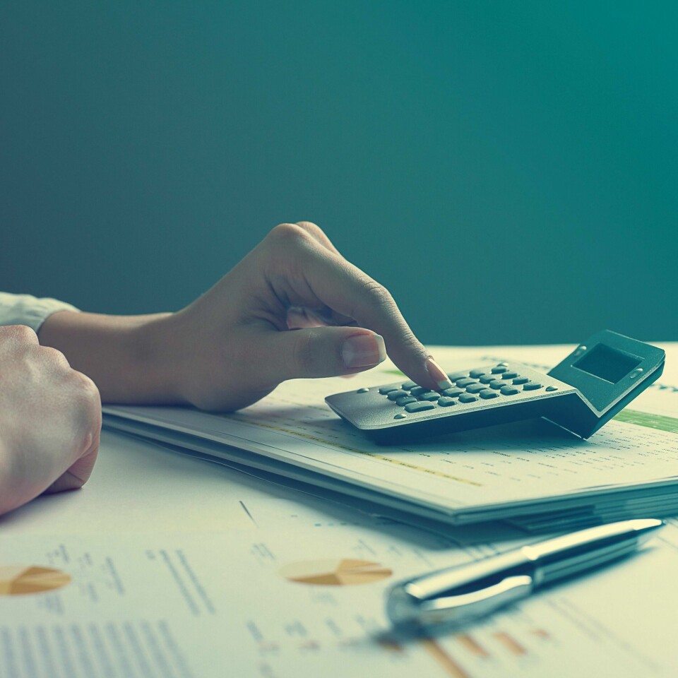 Analyzing Business Data - pen and numbers on paper
