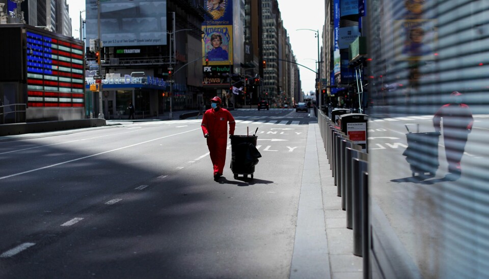 A Times Square Alliance street sweeper worker walks though a nearly empty Times Square in Manhattan during the outbreak of the coronavirus disease (COVID-19) in New York City, New York, U.S., April 7, 2020. REUTERS/Mike Segar A Times Square Alliance street sweeper worker walks though a nearly empty Times Square in Manhattan during the outbreak of the coronavirus disease (COVID-19) in New York City, New York, U.S., April 7, 2020. REUTERS/Mike Segar