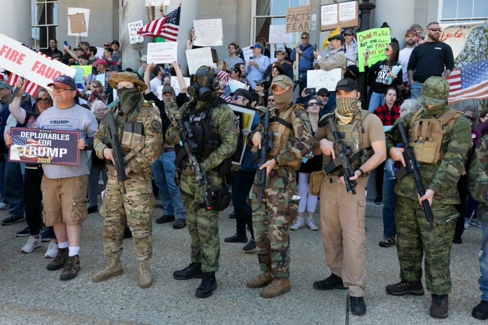 FILE - In this May 2, 2020, file photo, people, including those with the boogaloo movement, demonstrate against business closures due to concern about COVID-19, at the State House in Concord, N.H. It's a fringe movement with roots in a online meme culture steeped in irony and dark humor. But experts warn that the anti-government boogaloo movement has attracted a dangerous element of far-right extremists. (AP Photo/Michael Dwyer, File) FILE - In this May 2, 2020, file photo, people, including those with the boogaloo movement, demonstrate against business closures due to concern about COVID-19, at the State House in Concord, N.H. It's a fringe movement with roots in a online meme culture steeped in irony and dark humor. But experts warn that the anti-government boogaloo movement has attracted a dangerous element of far-right extremists. (AP Photo/Michael Dwyer, File)