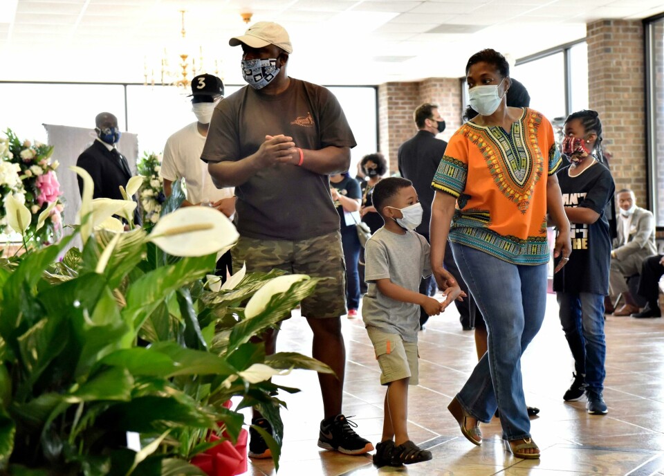 People pay their respects during a memorial service for George Floyd, Saturday, June 6, 2020, in Raeford, N.C. Floyd died after being restrained by Minneapolis police officers on May 25. (Ed Clemente/The Fayetteville Observer via AP, Pool) People pay their respects during a memorial service for George Floyd, Saturday, June 6, 2020, in Raeford, N.C. Floyd died after being restrained by Minneapolis police officers on May 25. (Ed Clemente/The Fayetteville Observer via AP, Pool)