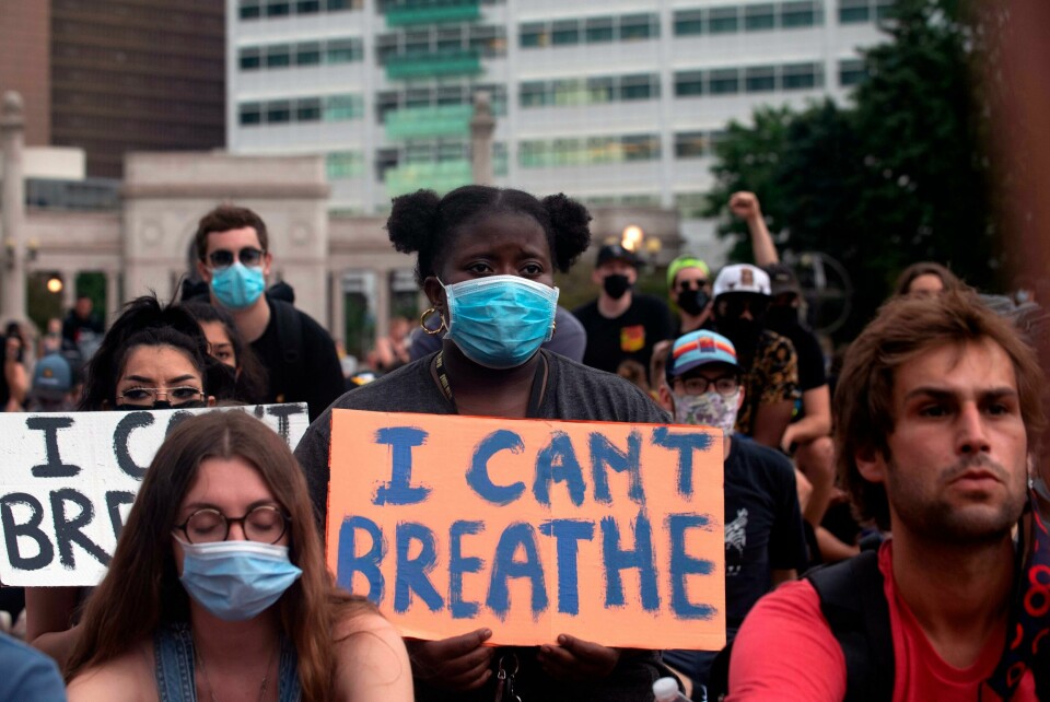 A demonstrator holds a sign in Denver, Colorado on June 3, 2020, while protesting the death of George Floyd, an unarmed black man who died while while being arrested and pinned to the ground by the knee of a Minneapolis police officer. - US protesters welcomed new charges brought Wednesday against Minneapolis officers in the killing of African American man George Floyd -- but thousands still marched in cities across the country for a ninth straight night, chanting against racism and police brutality. (Photo by Jason Connolly / AFP) A demonstrator holds a sign in Denver, Colorado on June 3, 2020, while protesting the death of George Floyd, an unarmed black man who died while while being arrested and pinned to the ground by the knee of a Minneapolis police officer. - US protesters welcomed new charges brought Wednesday against Minneapolis officers in the killing of African American man George Floyd -- but thousands still marched in cities across the country for a ninth straight night, chanting against racism and police brutality. (Photo by Jason Connolly / AFP)