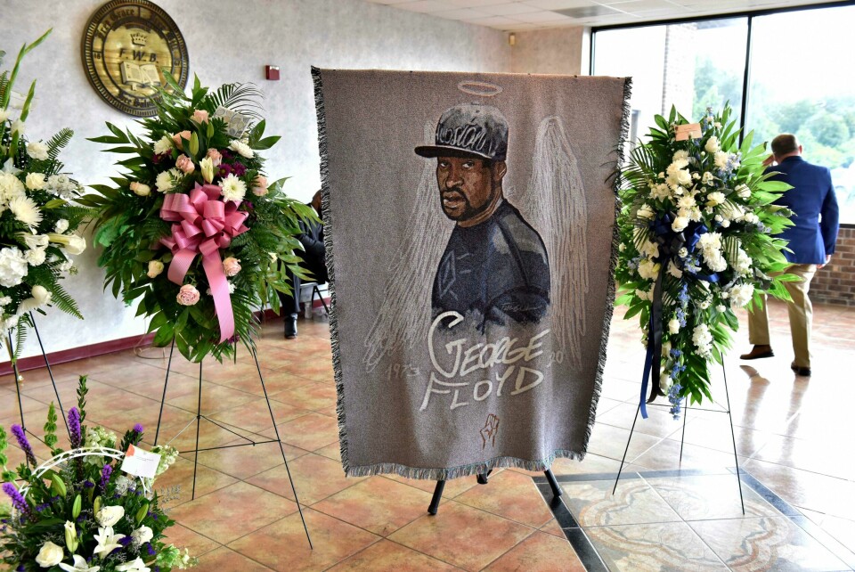 A picture of George Floyd and flowers are set up for a memorial service for Floyd, Saturday, June 6, 2020, in Raeford, N.C. Floyd died after being restrained by Minneapolis police officers on May 25. (Ed Clemente/The Fayetteville Observer via AP, Pool) A picture of George Floyd and flowers are set up for a memorial service for Floyd, Saturday, June 6, 2020, in Raeford, N.C. Floyd died after being restrained by Minneapolis police officers on May 25. (Ed Clemente/The Fayetteville Observer via AP, Pool)