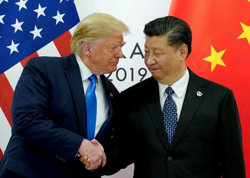 USAs president Donald Trump og Kinas president Xi Jinping under G20-møtet i Japan i juni 2019. Nå har USA og Kina signert første del av det som skal bli en omfattende handelsavtale. Foto: Kevin Lamarque/NTB scanpix