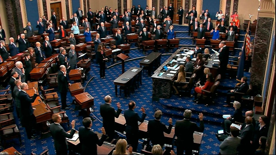 FILE - In this Thursday, Jan. 16, 2020, file image from video, presiding officer Supreme Court Chief Justice John Roberts swears in members of the Senate for the impeachment trial against President Donald Trump at the U.S. Capitol in Washington. Reporters at the Capitol want more cameras in the Senate to cover the impeachment trial and fewer restrictions to talk to senators when they are not sitting in judgment of the president. (Senate Television via AP, File)