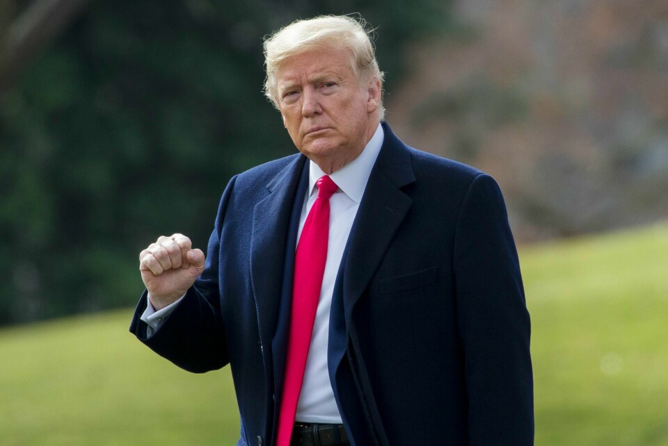 President Donald Trump pumps his fist as he walks on the South Lawn of the White House before boarding Marine One for a short trip to Andrews Air Force Base, Md., and then on to Michigan and Iowa, Thursday, Jan. 30, 2020, in Washington. (AP Photo/Alex Brandon)
