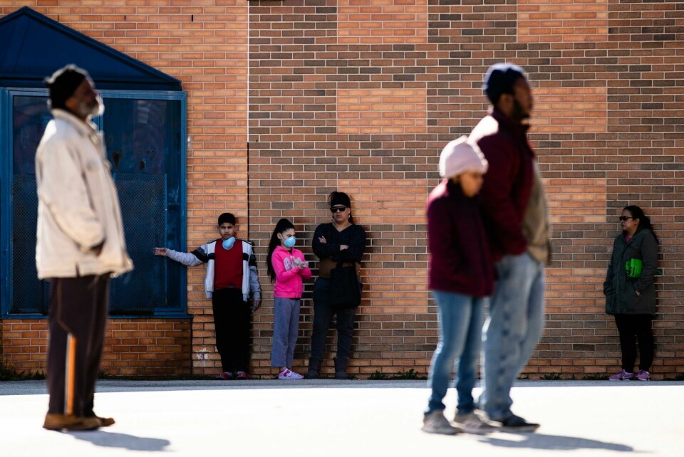 Families, standing several feet of distance from each other as an extra precaution out of concern about the spread of the coronavirus, wait in line to receive donated food and educational materials at the John H. Webster Elementary School in Philadelphia, Thursday, March 26, 2020. Gov. Tom Wolfs administration reported more coronavirus-related deaths in Pennsylvania on Wednesday. Residents are ordered to stay home, with few exceptions. (AP Photo/Matt Rourke) Families, standing several feet of distance from each other as an extra precaution out of concern about the spread of the coronavirus, wait in line to receive donated food and educational materials at the John H. Webster Elementary School in Philadelphia, Thursday, March 26, 2020. Gov. Tom Wolfs administration reported more coronavirus-related deaths in Pennsylvania on Wednesday. Residents are ordered to stay home, with few exceptions. (AP Photo/Matt Rourke)