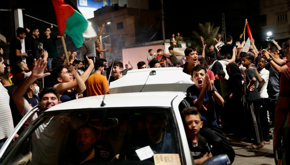 Palestinere på Gazastripen feiret natt til fredag våpenhvilen som trådte i kraft etter elleve dager med kamphandlinger. Palestinere på Gazastripen feiret natt til fredag våpenhvilen som trådte i kraft etter elleve dager med kamphandlinger. Foto: AP / NTB