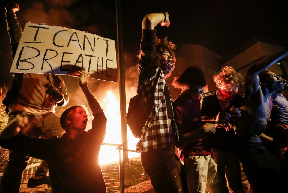 Protestors demonstrate outside of a burning Minneapolis 3rd Police Precinct, Thursday, May 28, 2020, in Minneapolis. Protests over the death of George Floyd, a black man who died in police custody Monday, broke out in Minneapolis for a third straight night. (AP Photo/John Minchillo) Protestors demonstrate outside of a burning Minneapolis 3rd Police Precinct, Thursday, May 28, 2020, in Minneapolis. Protests over the death of George Floyd, a black man who died in police custody Monday, broke out in Minneapolis for a third straight night. (AP Photo/John Minchillo)