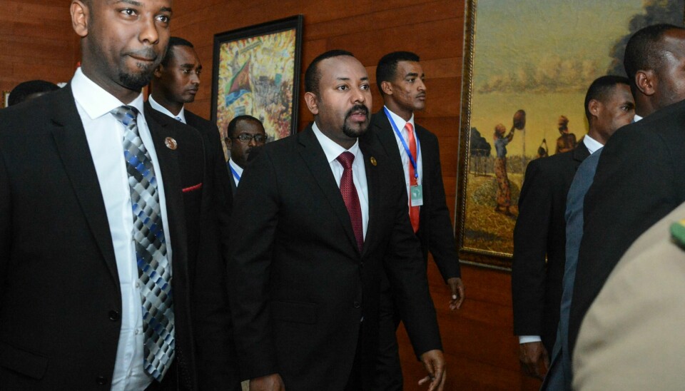 FILE - In this Sunday, Feb. 9, 2020, file photo, Ethiopia's Prime Minister Abiy Ahmed, center, arrives for the opening session of the 33rd African Union (AU) Summit at the AU headquarters in Addis Ababa, Ethiopia. Ethiopia's prime minister on Wednesday, Nov. 4, 2020 ordered the military to confront the Tigray regional government after he said it attacked a military base overnight, citing months of 'provocation and incitement' and declaring that 'the last red line has been crossed.' (AP Photo, File)