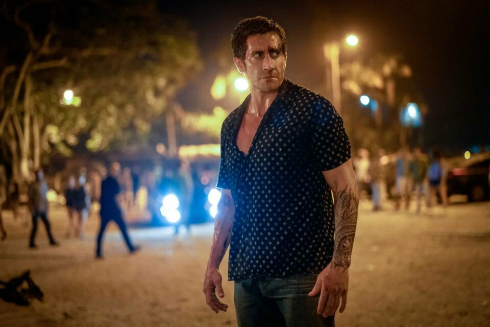 Jake Gyllenhaal går inn i Patrick Swayzes rolle som dørvakt og tidligere UFC-fighter i nyinnspillingen av actionfilmen «Road House», som har verdenspremiere på SXSW neste uke. Jake Gyllenhaal går inn i Patrick Swayzes rolle som dørvakt og tidligere UFC-fighter i nyinnspillingen av actionfilmen «Road House», som har verdenspremiere på SXSW neste uke. Foto: Prime Video / Handout / NTB