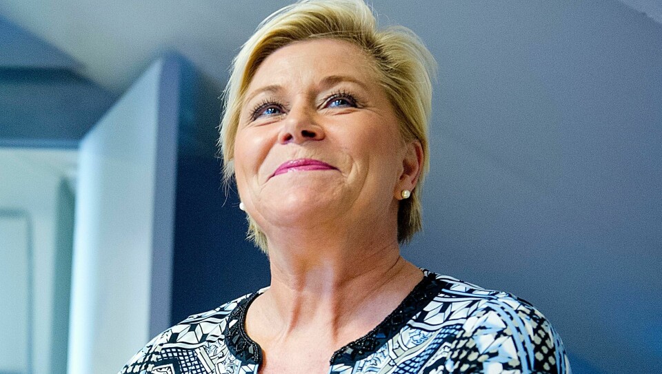 Siv Jensen har grunn til å glede seg over TV 2s ferske meningsmåling. Frp-lederen kan takke flykningkrisen, mener Arne Strand. FOTO: NTB scanpix