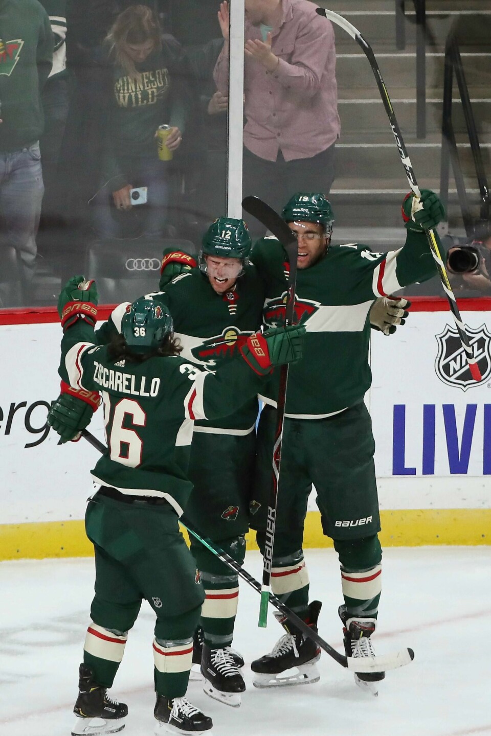 Minnesota Wild's Eric Staal, center, celebrates with Mats Zuccarello, left, and Jordan Greenway, right, after Staal scored a goal against Edmonton during the first period of an NHL hockey game Tuesday, Oct. 22, 2019, in St. Paul, Minn. (AP Photo/Stacy Bengs)