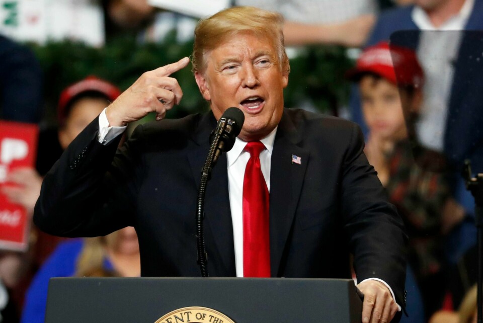 President Donald Trump talks about the fake snow that fell on his hair during a rally in the Mississippi Coast Coliseum, Monday, Nov. 26, 2018, in Biloxi, Miss. (AP Photo/Rogelio V. Solis)