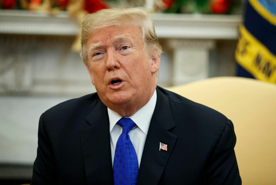 In this Dec. 11, 2018, photo, President Donald Trump speaks during a meets with Democratic leaders the Oval Office of the White House in Washington. The parent company of magazines including the National Enquirer, Us Weekly and In Touch has admitted to engaging in a journalistically dubious practice known as Äúcatch-and-killÄù in order to help Trump become president. (AP Photo/Evan Vucci)