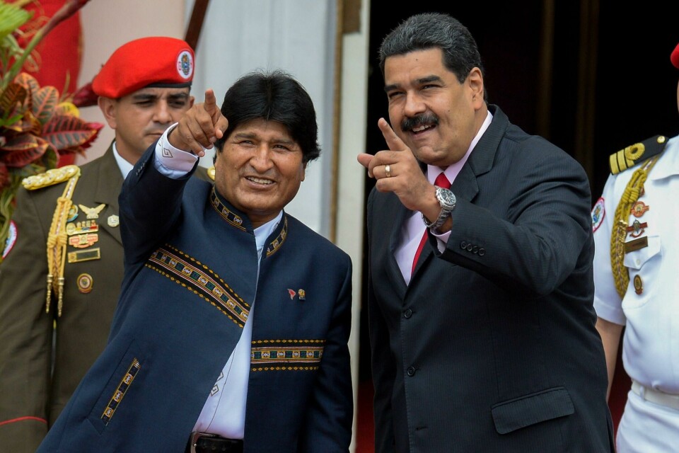 (FILES) In this file photo taken on March 5, 2017 Venezuelan President Nicolas Maduro (R) and Bolivian President Evo Morales gesture during the Bolivarian Alliance for the Peoples of Our America (ALBA) summit at the Miraflores presidential palace in Caracas. - Bolivian President Evo Morales resigned on November 10, 2019, caving in following three weeks of sometimes-violent protests over his disputed re-election after the army and police withdrew their backing. (Photo by Federico PARRA / AFP) (FILES) In this file photo taken on March 5, 2017 Venezuelan President Nicolas Maduro (R) and Bolivian President Evo Morales gesture during the Bolivarian Alliance for the Peoples of Our America (ALBA) summit at the Miraflores presidential palace in Caracas. - Bolivian President Evo Morales resigned on November 10, 2019, caving in following three weeks of sometimes-violent protests over his disputed re-election after the army and police withdrew their backing. (Photo by Federico PARRA / AFP)