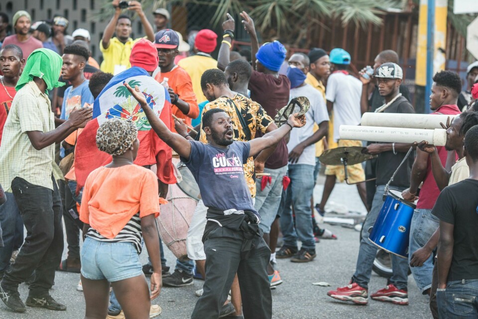 Protesters march to demand the resignation of President Jovenel Moise, in Port-au-Prince, Haiti, on November 10, 2019 after the opponents to the President reached an agreement for a political transition. (Photo by Valerie Baeriswyl / AFP) Protesters march to demand the resignation of President Jovenel Moise, in Port-au-Prince, Haiti, on November 10, 2019 after the opponents to the President reached an agreement for a political transition. (Photo by Valerie Baeriswyl / AFP)