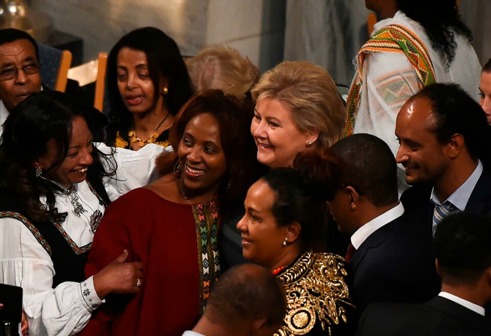 Norwegian prime minister Erna Solberg (C) pose for a picture with guests upon arrival for the Nobel Peace Prize ceremony at the city hall in Oslo on December 10, 2019. - The Ethiopian prime minister Abiy Ahmed is picking up his Nobel Peace Prize in the Norwegian capital as ethnic violence is on the rise at home, festivities are being kept to the bare minimum and he has refused to speak to the media cancelling this years Nobel Peace Prize press conference. (Photo by Fredrik VARFJELL / AFP) Norwegian prime minister Erna Solberg (C) pose for a picture with guests upon arrival for the Nobel Peace Prize ceremony at the city hall in Oslo on December 10, 2019. - The Ethiopian prime minister Abiy Ahmed is picking up his Nobel Peace Prize in the Norwegian capital as ethnic violence is on the rise at home, festivities are being kept to the bare minimum and he has refused to speak to the media cancelling this years Nobel Peace Prize press conference. (Photo by Fredrik VARFJELL / AFP)