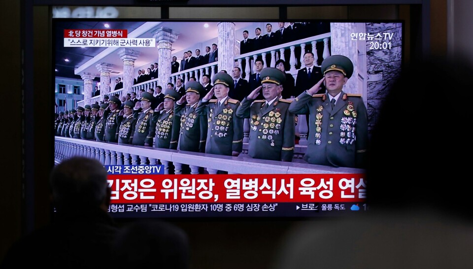 People watch a TV screen during a news program reporting about the ceremony to mark the 75th founding anniversary of the North Korea's ruling Workers' party, at the Seoul Railway Station in Seoul, South Korea, Saturday, Oct. 10, 2020. A part of letters read 'North Korean leader Kim Jong Un speaks at a military parade.' (AP Photo/Lee Jin-man) People watch a TV screen during a news program reporting about the ceremony to mark the 75th founding anniversary of the North Korea's ruling Workers' party, at the Seoul Railway Station in Seoul, South Korea, Saturday, Oct. 10, 2020. A part of letters read 'North Korean leader Kim Jong Un speaks at a military parade.' (AP Photo/Lee Jin-man)