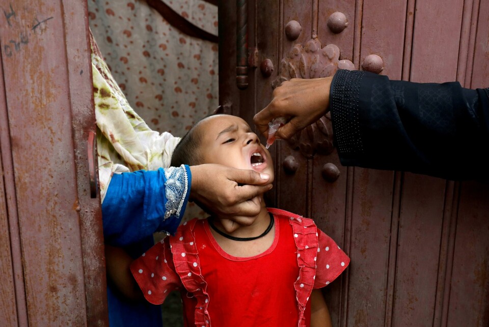 FILE PHOTO: A girl receives polio vaccine drops, during an anti-polio campaign, in a low-income neighborhood as the spread of the coronavirus disease (COVID-19) continues, in Karachi, Pakistan July 20, 2020. REUTERS/Akhtar Soomro/File Photo FILE PHOTO: A girl receives polio vaccine drops, during an anti-polio campaign, in a low-income neighborhood as the spread of the coronavirus disease (COVID-19) continues, in Karachi, Pakistan July 20, 2020. REUTERS/Akhtar Soomro/File Photo