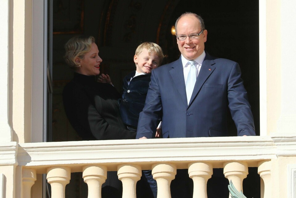 Prince Albert II of Monaco, Princess Charlene of Monaco and Prince Jacques appear on the palace's balcony during Sainte Devote Celebrations in Monaco on January 27, 2019. - Saint Devote is the patron saint of the Grimaldi family, reigning in Monaco, and is celebrated each year as a national holiday. (Photo by VALERY HACHE / AFP)