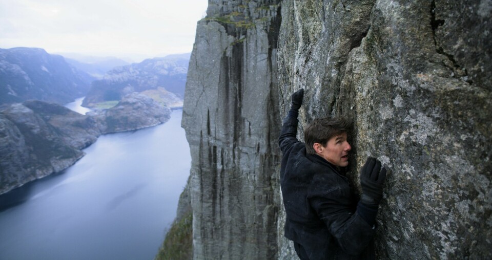 Tom Cruise klamrers seg fast i den norske fjellveggen i «Mission: Impossible - Fallout» - i filmen et indisk fjell. Tom Cruise klamrers seg fast i den norske fjellveggen i «Mission: Impossible - Fallout» - i filmen et indisk fjell.