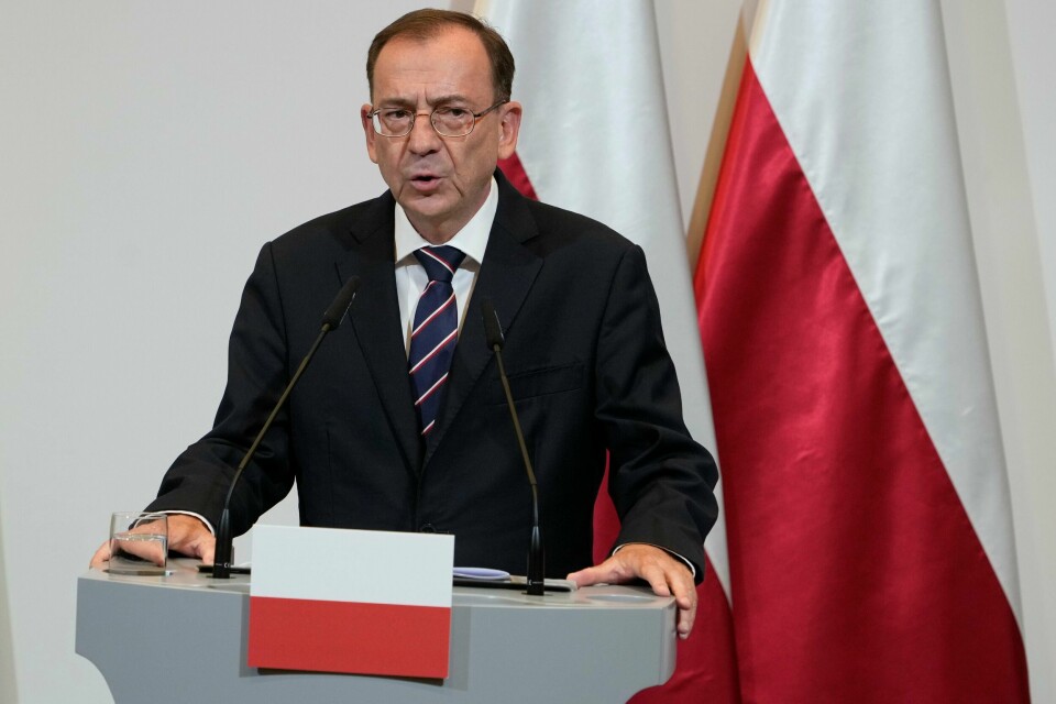 Polens innenriksminister Mariusz Kaminski på mandagens pressekonferanse. Polens innenriksminister Mariusz Kaminski på mandagens pressekonferanse. Foto: Czarek Sokolowski / AP / NTB