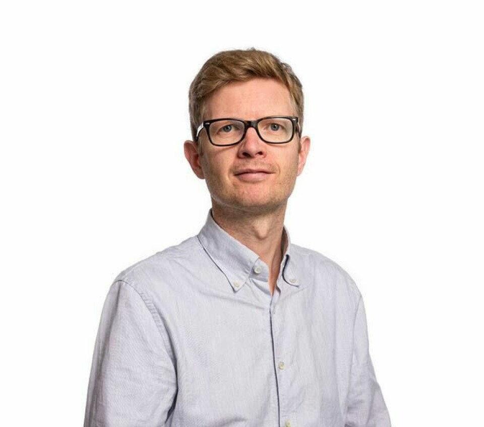 Einar Olav Larsen Mann med briller, smiler svakt