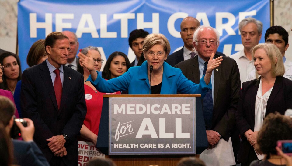 Elizabeth Warren (midten) og Bernie Sanders (t.h.) kjemper begge for å endre det amerikanske helsevesenet. Foto: Jim Wattson/NTB scanpix