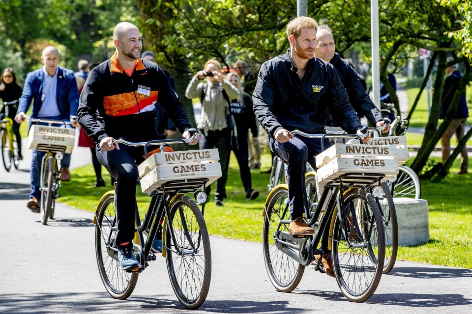 Former Dutch serviceman and athlete Dennis Van Der Stroom (L) and Prince Harry (R) ride a bike during the presentation of the Invictus Games The Hague 2020, in The Hague, Netherlands, on May 9, 2019. - The fifth Invictus Games The Hague 2020, an international sporting event for wounded, injured and sick servicepersonnel, will be held in the Zuiderpark in 2020. (Photo by patrick van katwijk / ANP / AFP) / Netherlands OUT Former Dutch serviceman and athlete Dennis Van Der Stroom (L) and Prince Harry (R) ride a bike during the presentation of the Invictus Games The Hague 2020, in The Hague, Netherlands, on May 9, 2019. - The fifth Invictus Games The Hague 2020, an international sporting event for wounded, injured and sick servicepersonnel, will be held in the Zuiderpark in 2020. (Photo by patrick van katwijk / ANP / AFP) / Netherlands OUT