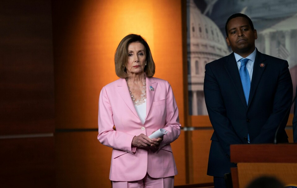 Speaker of the House Nancy Pelosi, D-Calif., joined at right by Rep. Joe Neguse, D-Colo., leads other House Democrats to discuss H.R. 1, The For the People Act, which passed in the House but is being held up in the Senate, at the Capitol in Washington, Friday, Sept. 27, 2019. (AP Photo/J. Scott Applewhite)