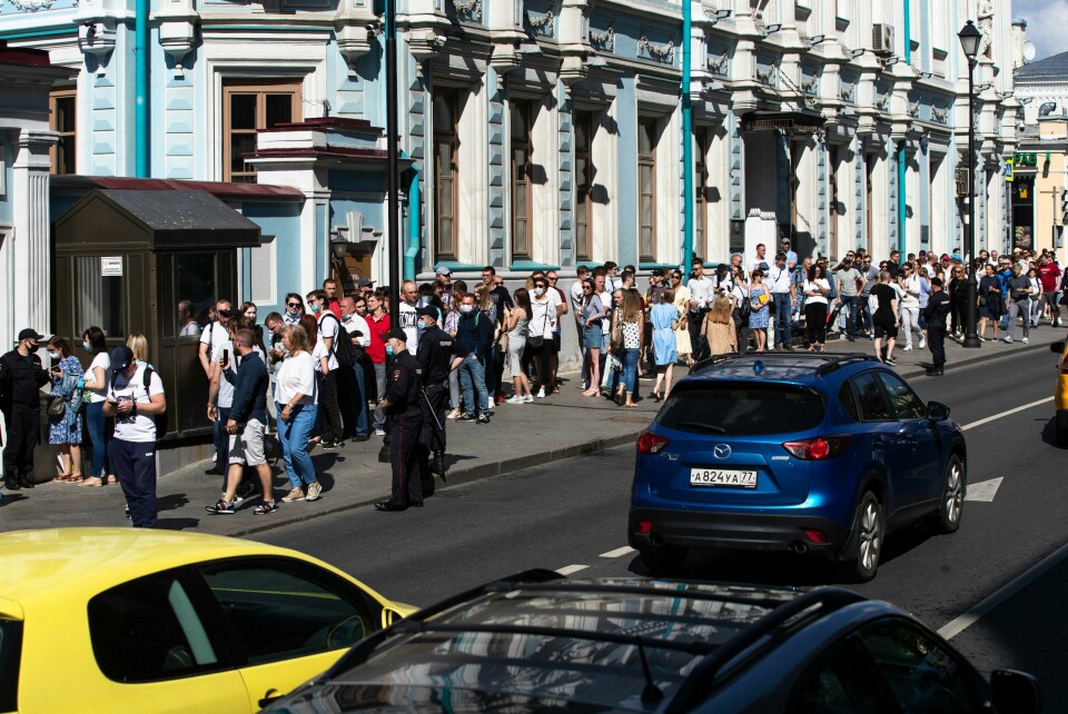 People queue to cast their votes in the Belarusian presidential election at the Belarusian Embassy in Moscow, Russia, Sunday, Aug. 9, 2020. Belarusians are voting on whether to grant incumbent president Alexander Lukashenko a sixth term in office, extending his 26-years rule, following a campaign marked by unusually strong demonstrations by opposition supporters. (AP Photo/Pavel Golovkin) People queue to cast their votes in the Belarusian presidential election at the Belarusian Embassy in Moscow, Russia, Sunday, Aug. 9, 2020. Belarusians are voting on whether to grant incumbent president Alexander Lukashenko a sixth term in office, extending his 26-years rule, following a campaign marked by unusually strong demonstrations by opposition supporters. (AP Photo/Pavel Golovkin)