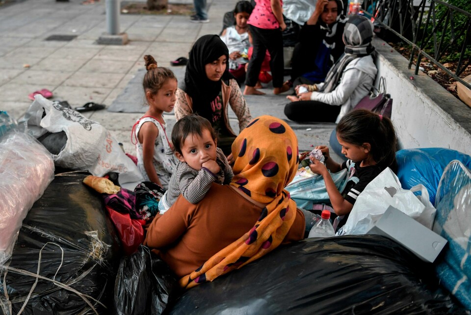 A child looks on as Afghan families who arrived, from Moria camp on the island of Lesbos camp, at an central Athens square on June 14, 2020 after receiving a blue stamp which allowed them to travel to the mainland. - At least 66 refugees, who arrived from the island after their asylum applications where approved, camp on the square as they have no place to stay in Athens. (Photo by Louisa GOULIAMAKI / AFP) A child looks on as Afghan families who arrived, from Moria camp on the island of Lesbos camp, at an central Athens square on June 14, 2020 after receiving a blue stamp which allowed them to travel to the mainland. - At least 66 refugees, who arrived from the island after their asylum applications where approved, camp on the square as they have no place to stay in Athens. (Photo by Louisa GOULIAMAKI / AFP)